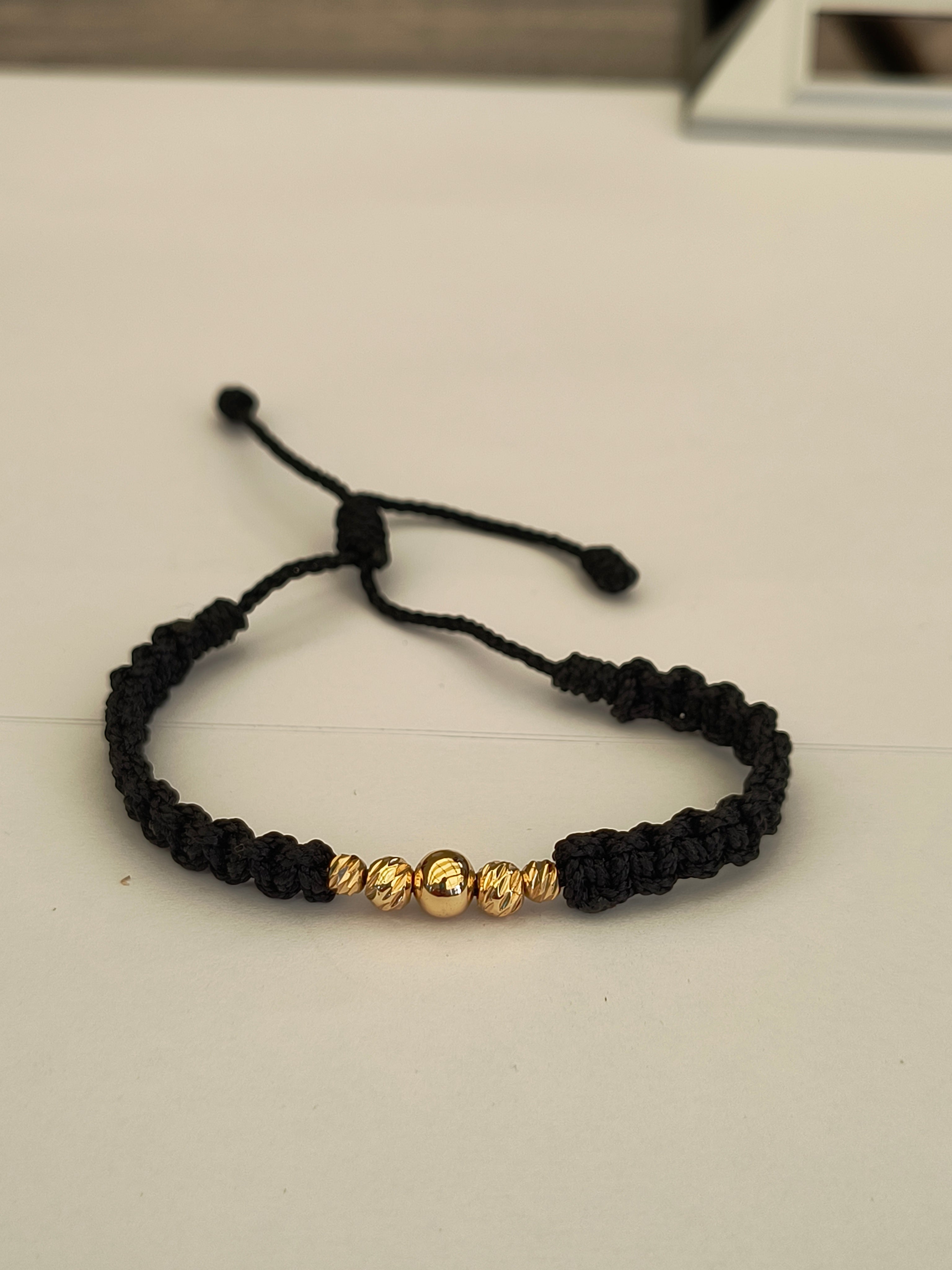 Pulsera tejida- Balines de Oro laminado